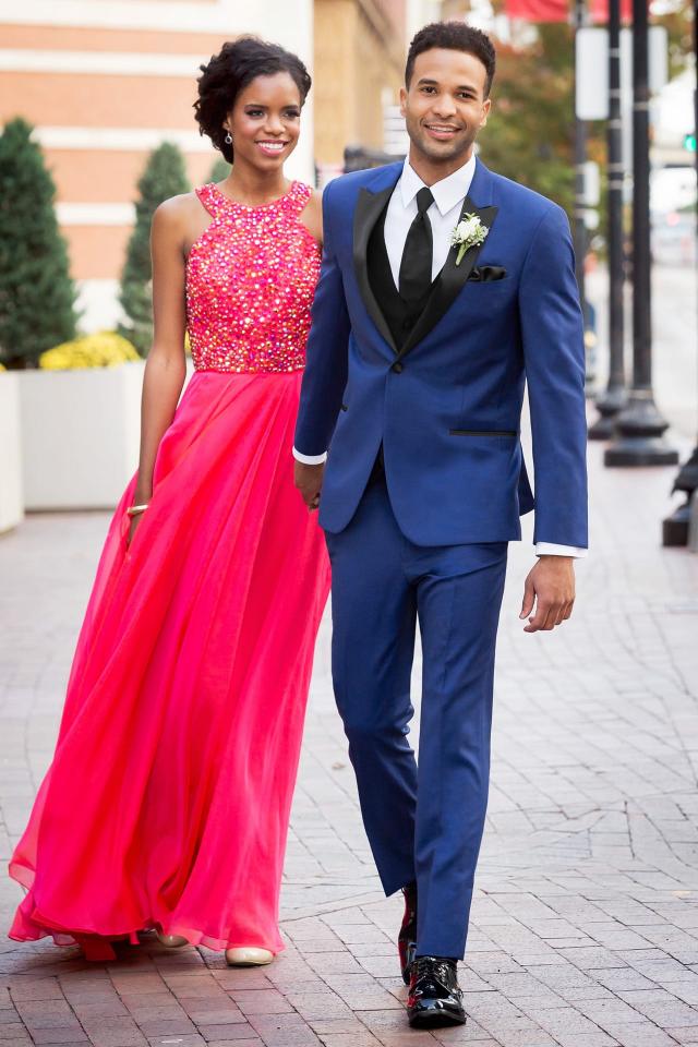 Couple walking down the street in a Prom Tuxedo Blue Ike Behar Tribeca with Black Fullback Vest and Skinny Windsor Tie