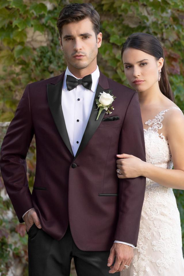 Standing outside in a Wedding Tuxedo Burgundy Kenneth Cole Empire with Microfiber Shirt and Black Bow Tie