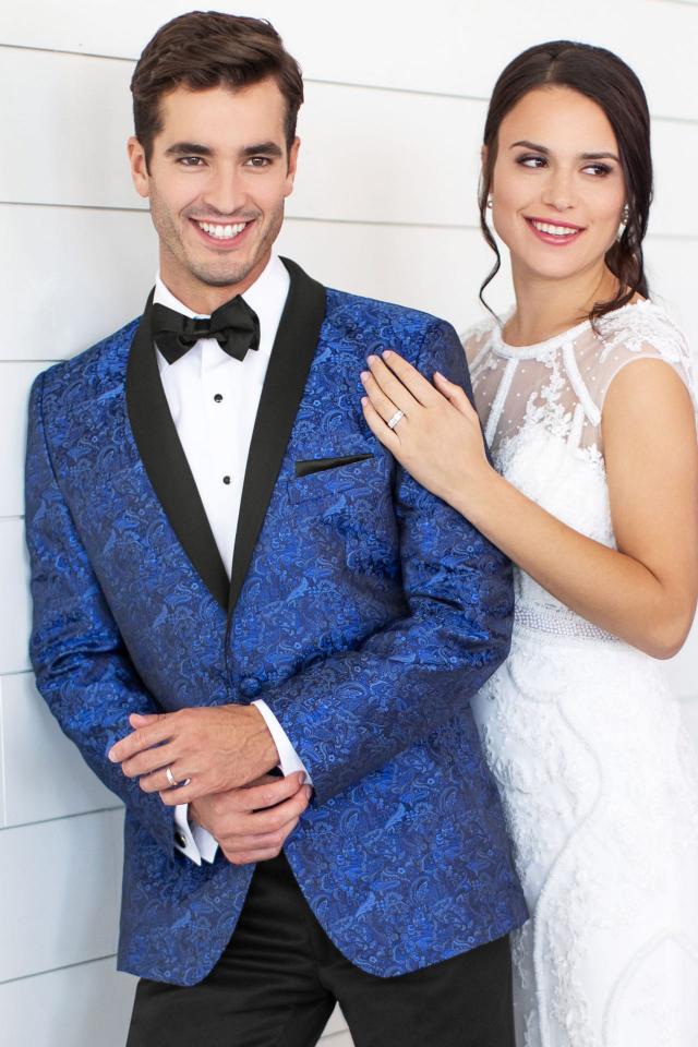 Guy jut got married and next to his wife while in the Wedding Tuxedo Cobalt Blue Paisley Mark of Distinction Aries