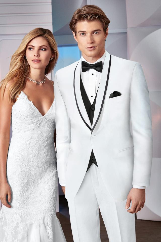 Couple after marriage in a Wedding Tuxedo White Ike Behar Waverly with White Pants and Black Expressions Fullback Vest and Bow Tie